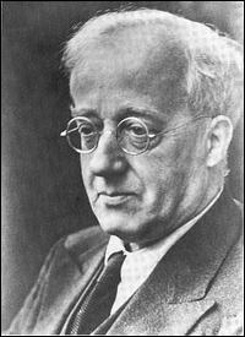 A black and white photo of Gustav Holst as a middle aged man
